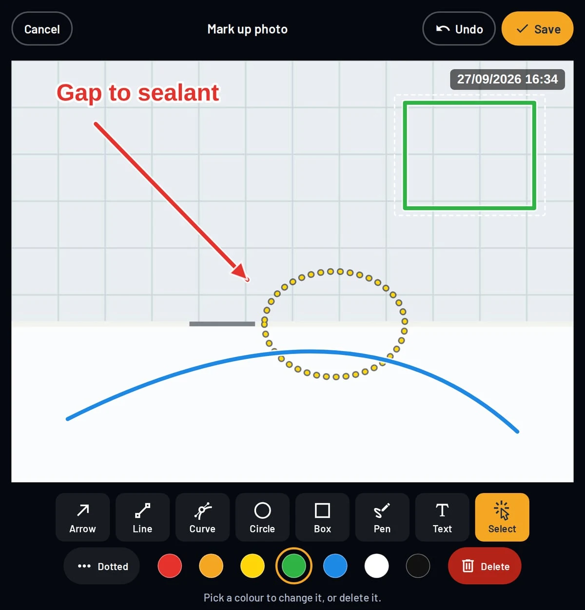 Marking up a photo in SnagPad with an arrow, text, a dotted circle and a box, stamped with the date and time
