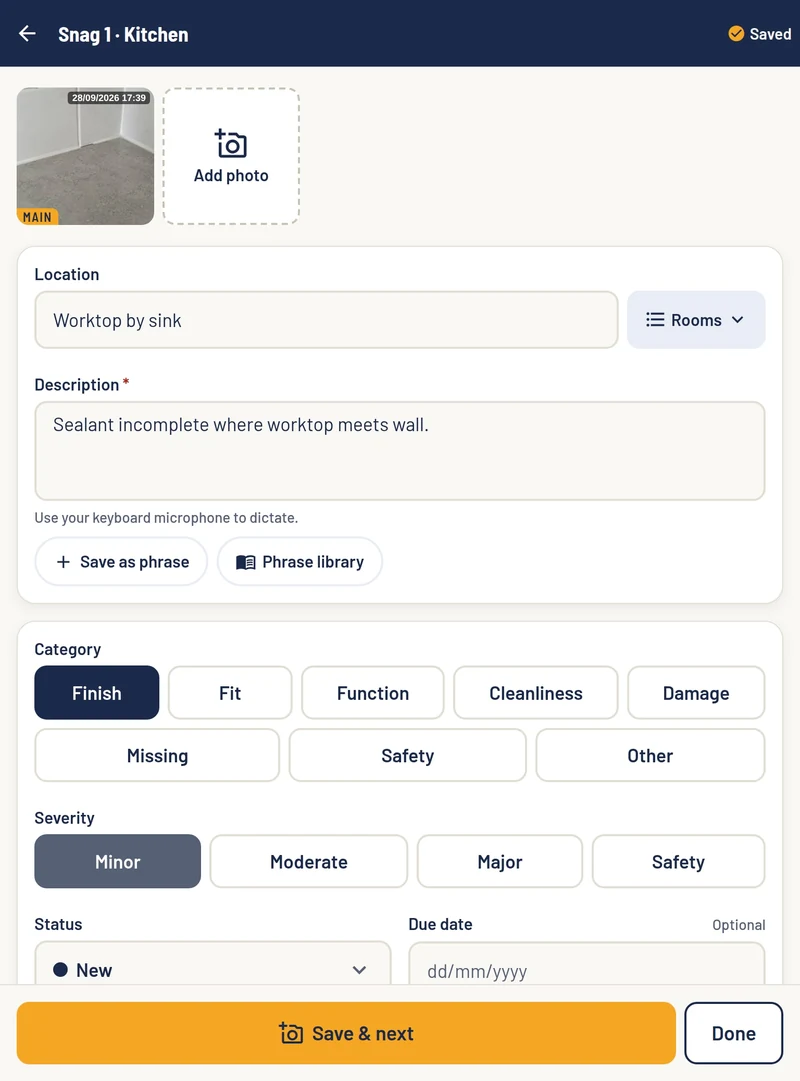 SnagPad on an iPad: snag 1 in the kitchen, with its date-stamped photo, location, description, phrase library, category and severity